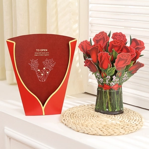 Detailed instructions and beautiful 3D popup red rose card on a woven mat