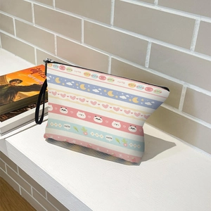 Striped cosmetic bag with bear pattern and zipper closure for travel and daily storage