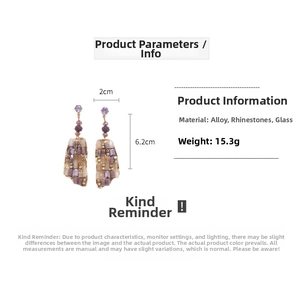 Detail view of Bohemian glass drop earrings with purple rhinestones and alloy frame