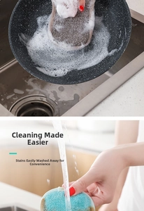 Dual-sided kitchen sponge creating rich foam in pan and rinsing under running water