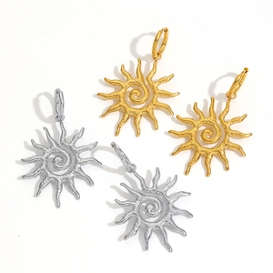 Retro sunflower earrings in gold and silver finish with textured spiral sunburst design