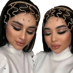 Exotic gold bridal headband with shimmering rhinestone wave design for wedding parties