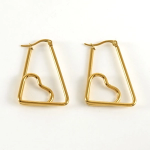 Detailed view of gold geometric trapezoid earrings with hollow heart design and polished finish