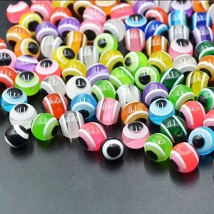 Macro shot of colorful resin evil eye beads in mixed colors for DIY jewelry making