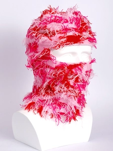 Detail of pink and red knitted balaclava showing fringe texture on white mannequin
