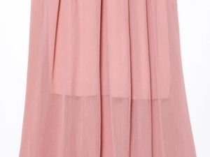 Macro shot of pleated dusty pink chiffon fabric with matching inner lining texture