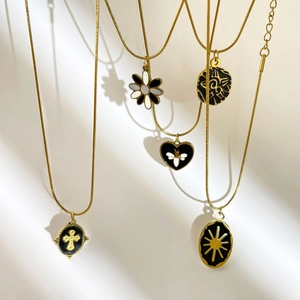 Five assorted 18K gold-plated titanium steel necklaces with black enamel charms for women