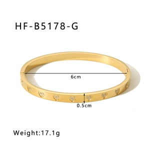 Detail of 18K gold-plated heart-shaped bangle showing size dimensions and weight