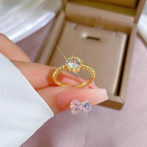 Minimalist gold spiral twisted open ring with a sparkling round zircon stone for women