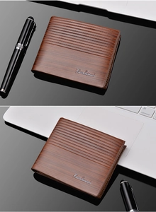 Detailed close-up of a brown men's bi-fold wallet with elegant textured patterns