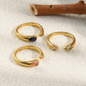 Detail view of 18K gold plated C-shaped snake rings with colorful pear-cut zircon stones