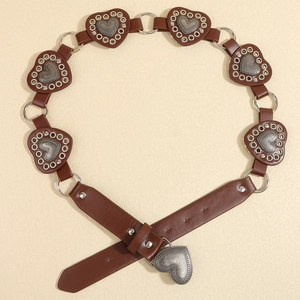 Close-up of brown leather western belt featuring heart-shaped metal rivets and eyelets