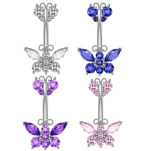 Macro detail of butterfly belly button rings with colorful zircon stones in studio light