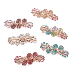 Bow-shaped rhinestone hair clips set in various colors on rose gold alloy base