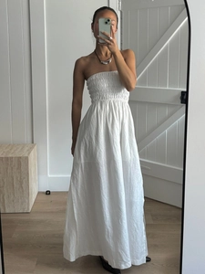White cotton strapless maxi dress with smocked bodice and pleated high waist design
