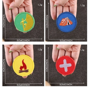 Detailed embroidery texture on round scout patches for camping and climbing
