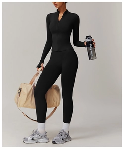 Women's slim fit black yoga set with thumb holes, high waist leggings and gym bag