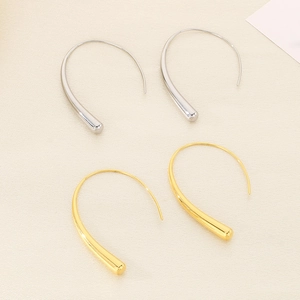 Minimalist sleek gold and silver earrings with streamlined design and polished finish