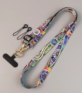 Macro shot of adjustable crossbody phone strap with colorful bohemian totem pattern