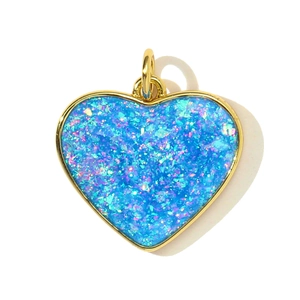 Deep blue opal heart pendant with golden metal edge and colorful glitter flakes