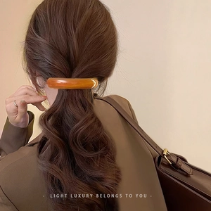Elegant amber curved spring clip for women ponytail hair styling on model back view