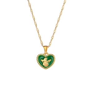 Close-up of heart-shaped green enamel angel pendant on an 18K gold plated chain
