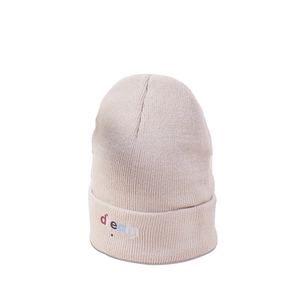Close-up of pink knit beanie showing ribbed texture and dream star embroidery