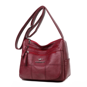 Burgundy faux leather crossbody bag for women with multi-pocket design and adjustable strap