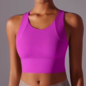 Close-up of a magenta yoga sports bra featuring wide straps and moisture-wicking fabric