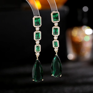 Elegant gold drop earrings with tiered green emerald stones and zircon accents