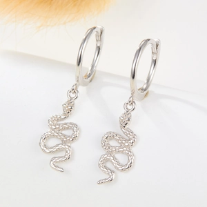 Close-up of S925 sterling silver snake earrings showing detailed scale texture and craft