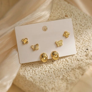 Three-pair set of 18K gold plated heart geometric stud earrings on display card