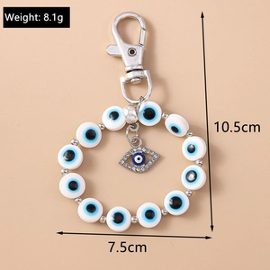 Detail view of Evil Eye beaded keychain showing 10.5cm length and 8.1g weight specifications