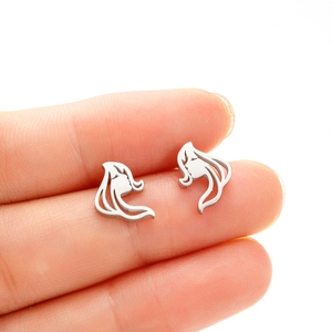 Detailed close-up of a long-haired girl silhouette earring in polished silver steel