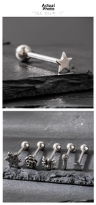 Detailed close-up of stainless steel studs featuring snowflake, rose, and spider designs