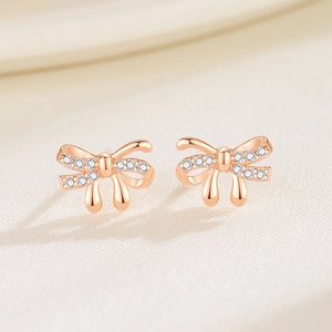 Sparkling 925 sterling silver bow knot stud earrings with zircon in rose gold plating