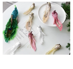 Close-up of colorful foam birds with sequins and feathers for Christmas tree decoration