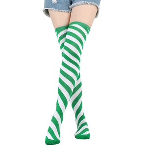 Detail view of green and white striped over-knee socks in high-quality knitted fabric