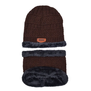 Detail of warm winter knitted beanie and neck warmer with thick grey faux fur lining