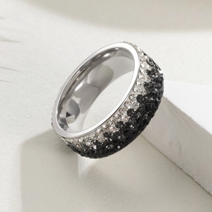 Macro view of 8mm wide stainless steel ring with five rows of sparkling inlaid rhinestones