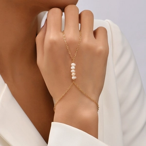 Vintage gold hand chain bracelet with baroque pearls and integrated ring for women