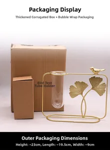 Detail of gold ginkgo leaf metal frame hydroponic vase with glass tube and packaging