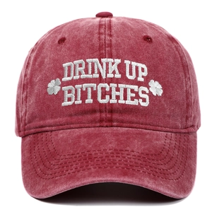 Detailed embroidery of Drink Up Bitches slogan on washed burgundy vintage baseball cap