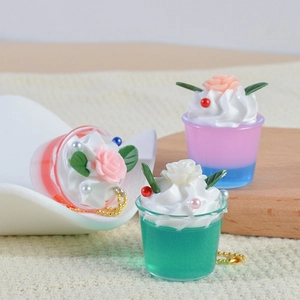 Miniature cream dessert keychain set with colorful gradient cups and floral toppings