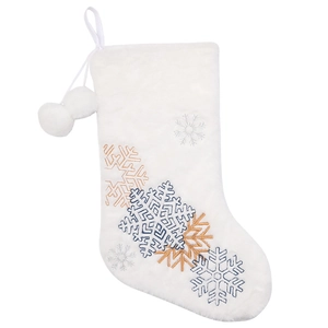 White plush Christmas stocking with embroidered snowflakes and soft pom-poms decor