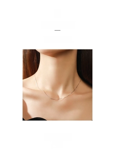Minimalist S925 sterling silver snake chain necklace shown on a model's collarbone