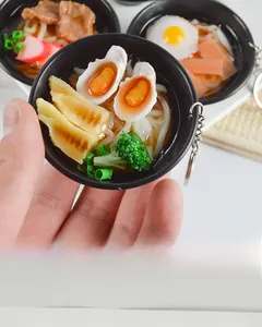 Miniature Japanese ramen noodle keychain featuring detailed toppings and small black bowl