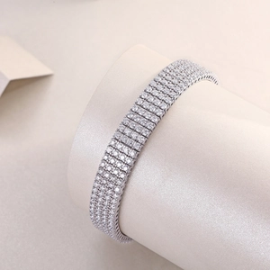 Detailed macro view of the three-row pavé-set crystals on this silver tennis bracelet
