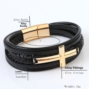 Macro view of multi-layer woven leather bracelet with gold cross and magnetic alloy buckle