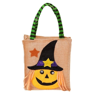 Halloween pumpkin witch burlap candy tote bag with striped handles on white background